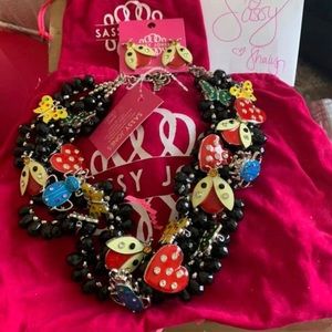 ISO the set. Earrings, bracelet and bib.